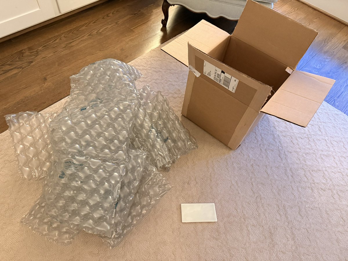 brianwilson's tweet photo. Ok @tilebar one of your shippers is trolling us or you only have one size shipping box. 14” squared box with 4lbs of postage and packing for a single subway tile? And it was free? We’ve had a good laugh but seriously? https://t.co/4oeSjw9KpR