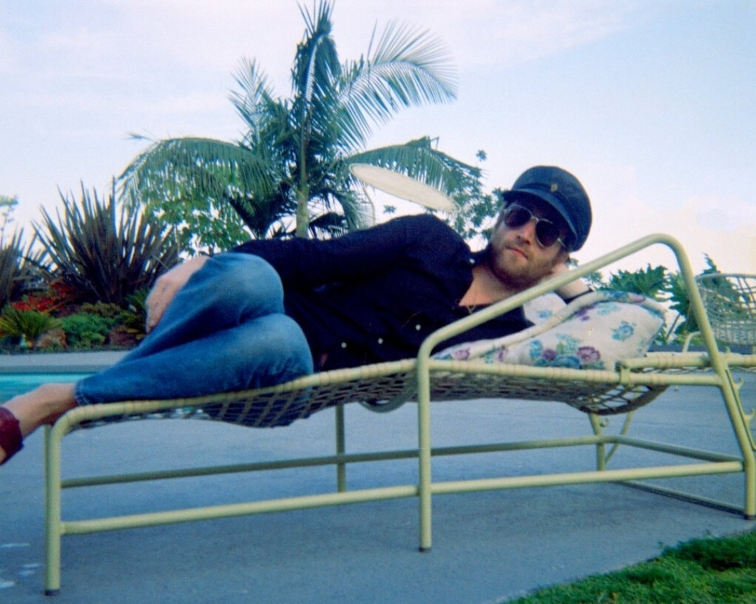 ceofjohnlennon's tweet photo. John Lennon photographed by Yoko Ono at the hotel pool in Bel-Air, California, June, 1970. https://t.co/JxXHfD16Y5
