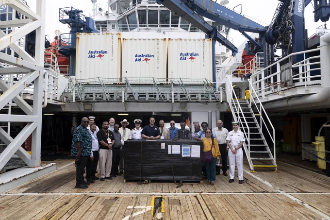 📷 Australian Defence Personnel and Government Officials, Papua New Guniea Government officials and academics from Papua New Guines University of Technology infront of seismic requpment delivered by ADV Reliant in Lae, Papua New Guinea