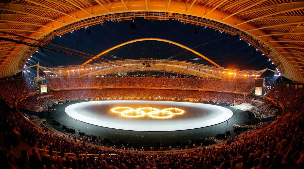 iocmedia's tweet photo. 22 years ago today, #Athens2004 opened in Greece, marking a symbolic return of the Olympic Games to their historic birthplace. A celebration of Olympic tradition, excellence and unity.🌐👇

#ThrowBackThursday

🔗https://t.co/OSDtnAP1W9 https://t.co/WnLgSRWJcg