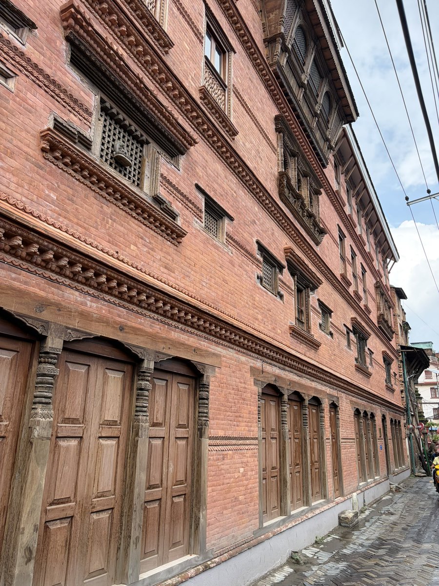 DamonZumbroegel's tweet photo. Is a street full of Facades enough?  -  What makes good design? 
I’m an architect, and was just working in Nepal for a few months. The new architecture of Nepal is sooooo bad, concrete post and beam and infill.  I went to Patan (oldest part of Kathmandu, and nucleus of the Nepali style) for a week, and saw something amazing…….they were making people put classic facades on the horrible concrete structures!  It is lovely, and I appreciated it.  But then I started to think…..”is this just Disneyland?”  A Hollywood set?  Facades on shitty buildings?  Yes it is.  It looks pretty, but behind the facade is still shit!  The design has to go all the way through, not just be make up.  Old Nepal architecture was made for life, in the interiors and exteriors.