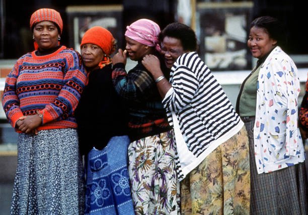 HistorySAZAR's tweet photo. A group of women from Mdamstane Township giggle as they wait to vote in the first democratic election, in East London, South Africa, 1994. Credit: Susan Winters Cook https://t.co/FF8I9yGXDv