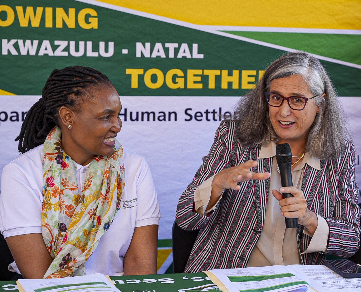 UNinSouthAfrica's tweet photo. For families who’ve waited years for a home, today changed everything. @UNHABITAT ED, @AnacludiaRossb1 &amp; @The_DHS Minister, @ThembiSim73 visited Kennedy Road, eThekwini, where houses were handed over, part of the city’s urban agenda. Tomorrow, @UNHABITAT🇿🇦 opens its doors here. https://t.co/OhMZuJPlsK
