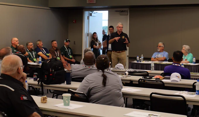 FMCSA Administrator Derek D. Barrs speaks wiht competitors at the 2026 National Truck Driver Championships. 