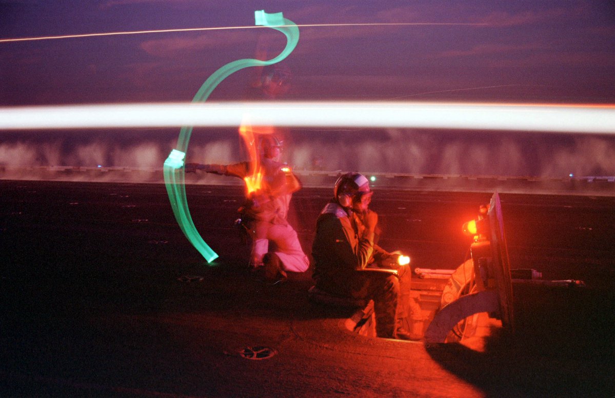 amerpipedream's tweet photo. 🇺🇸 Nighttime shots of US Navy carrier operations, including a long-exposure photo of an F-14 Tomcat taking off.

Goes hard. 

US Navy Chambray Utility Shirts are in stock at AP. https://t.co/kqlMpoK2zc