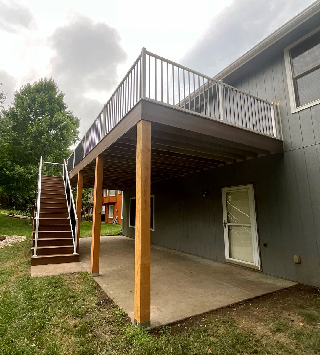 WDRemodel's tweet photo. Our latest deck project is a real head-turner with the white Westbury posts and handrails accented by black balusters. This addition adds usable space above and below! 

Perfect for gathering or relaxation. Call us today to see what WD&amp;R can do for you. 785-582-2888 https://t.co/5YKCRB1fTS