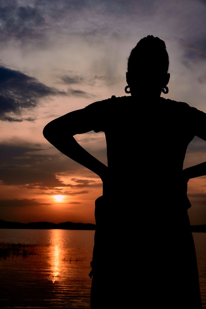 PrinceDGarba's tweet photo. Sunset 
The sunset whispers, the silhouettes stay,
And Tagwai rests beneath the dying day.
For a moment, the world feels still,
As gold meets water beyond the hill. https://t.co/eturtPez4s