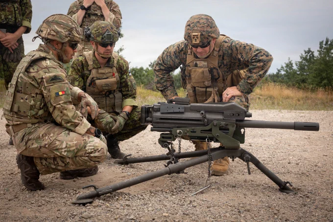 U.S. Marine Corps Gunnery Sgt. Joshua Brewer, right, company gunnery sergeant, 4th Combat Readiness Regiment, 4th Marine Logistics Group, Marine Forces Reserve, goes over the operating procedures of a Mark 19 automatic grenade launcher with British Army Soldier Capt. John Woodman, platoon commander, 103rd Force Support Battalion, Royal Electrical and Mechanical Engineers, left, and Estonian Defence Force Soldier 2nd Lt. Toomas Pihl, middle, platoon commander, Estonian Defence League, Southern Command, Sniper Platoon, during Northern Strike 26-2, Camp Grayling, Michigan, August 9, 2026. Northern Strike is an Army sponsored, multi-component, multi-national exercise designed to build readiness and enhance interoperability to fight and win. Northern Strike 26-2, Michigan\u2019s largest and longest joint readiness exercise, is held from August 1 to August 15, 2026 at the National All-Domain Warfighting Center.  (U.S. Marine Corps photo by Lance Cpl.\u202FNalanie Davila)\n\n