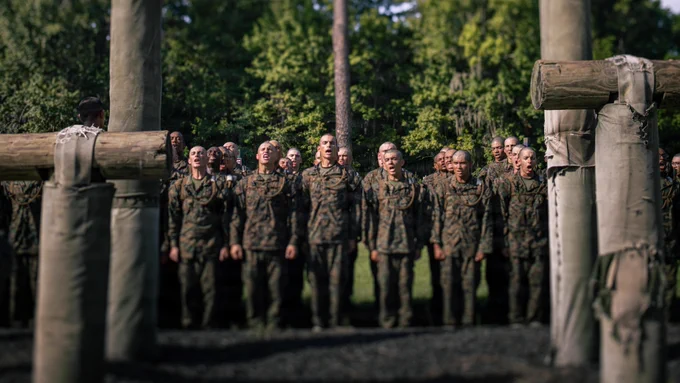 Recruits with Hotel Company, 2nd Recruit Training Battalion, stand in formation as they wait to conduct the Confidence Course on Marine Corps Recruit Depot Parris Island, S.C., Aug. 10, 2026. After demonstrations, recruits complete various physically and mentally challenging obstacles. (U.S. Marine Corps photo by Lance Cpl. Ayden Cassano)\n