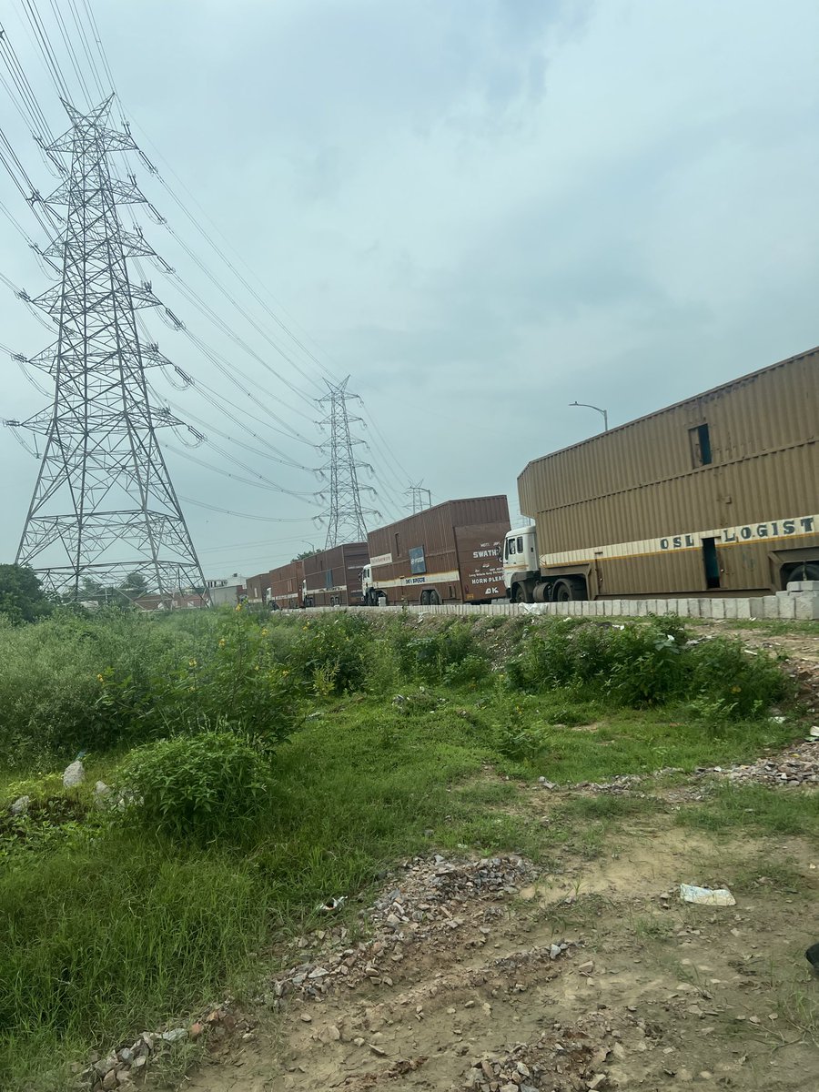 aditimalhotra's tweet photo. Sector 70A Ggn. For weeks newly constructed roads being used as an offloading dock for a cab company’s fleet. crossings r now blind spots, taking away right of passage for ppl &amp; traffic. threat to safety large groups of drunk men sitting at unauth pan shop.@OfficialGMDA https://t.co/zAa2bCFVy4