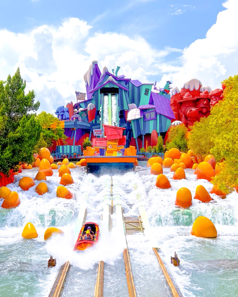 A ride boat on Dudley Do-Right's Ripsaw Falls going down the ride hill. 