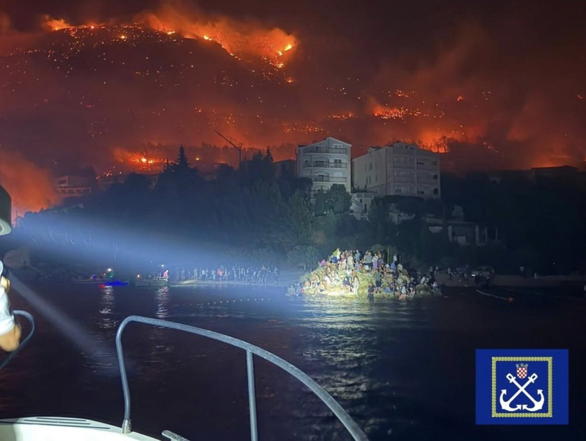 Goran_Majic's tweet photo. Current situation on Friday morning in Omiš #Croatia: The wildfire is under control, but firefighters still face a long battle to fully contain it. Ten people are in intensive care, including a 17-year-old girl. Seven are fighting for their lives. 

Prime Minister Plenković in Omiš: “This is one of the worst fires in recent years.” He said the government will help Omiš and Split-Dalmatia County deal with the aftermath of the fire.

The Ministry of Tourism and the Croatian National Tourist Board will also assist tourists who were forced to leave their accommodation because of the fire. Some tourists and other evacuees have been accommodated in the sports hall in Omiš and at Gripe in Split. Plenković said efforts would be made to find them alternative accommodation, while also allowing them to return to their original accommodation once safety conditions permit. 

Photo: Nearly 200 people rescued from the sea near Omiš after fleeing the fire by taking refuge in the water. 

Firefighters have brought the blaze near Lokva Rogoznica under control after it burned around 900 hectares.