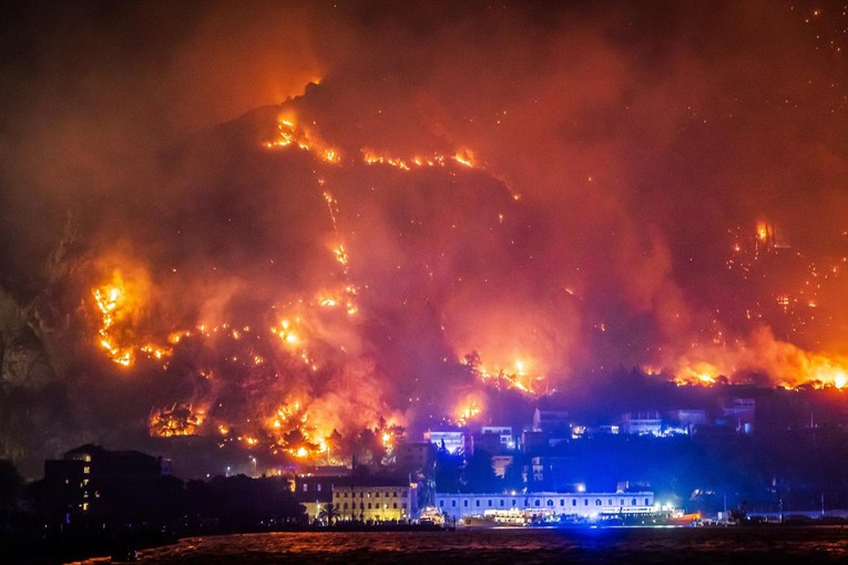 Goran_Majic's tweet photo. Current situation on Friday morning in Omiš #Croatia: The wildfire is under control, but firefighters still face a long battle to fully contain it. Ten people are in intensive care, including a 17-year-old girl. Seven are fighting for their lives. 

Prime Minister Plenković in Omiš: “This is one of the worst fires in recent years.” He said the government will help Omiš and Split-Dalmatia County deal with the aftermath of the fire.

The Ministry of Tourism and the Croatian National Tourist Board will also assist tourists who were forced to leave their accommodation because of the fire. Some tourists and other evacuees have been accommodated in the sports hall in Omiš and at Gripe in Split. Plenković said efforts would be made to find them alternative accommodation, while also allowing them to return to their original accommodation once safety conditions permit. 

Photo: Nearly 200 people rescued from the sea near Omiš after fleeing the fire by taking refuge in the water. 

Firefighters have brought the blaze near Lokva Rogoznica under control after it burned around 900 hectares.