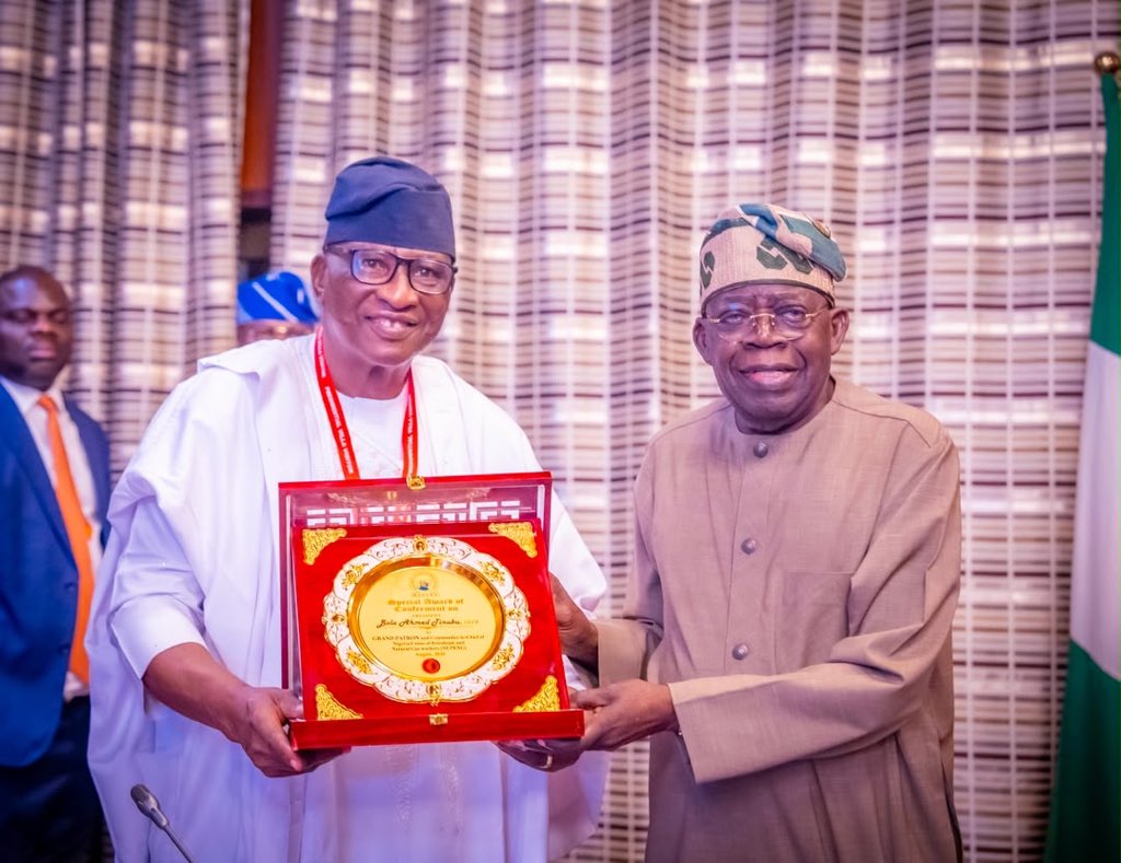 HMMohammedIdris's tweet photo. Yesterday, at the State House, the Nigerian Union of Petroleum and Natural Gas Workers (NUPENG) decorated President Bola Ahmed Tinubu as the Grand Patron of the Union. 

It was a pleasure to witness this, during the President’s meeting with national executives of the Union, led by its National Executive President, Comrade (Dr.) Salimon Akanni Oladiti. 

Various issues were discussed, including the nation’s refineries, the Presidential Initiative on Compressed Natural Gas, and the inspiring legacy of former NUPENG president, the late Frank Kokori, a friend of President Tinubu and close associate in the fight for democracy. 

NUPENG thanked the President for his bold fiscal reforms and massive infrastructural drive. On the ambitious road projects across the country, the NUPENG leader told the President, “Every stretch of highway rehabilitated or constructed means fewer accidents, fewer spillages, fewer lives lost, and less stress for the men behind the wheels. Mr President, that is a reform our members feel in their bones, and for it we say thank you because our tanker drivers and other road users are already seeing the benefits of the rehabilitation and construction of federal highways.”