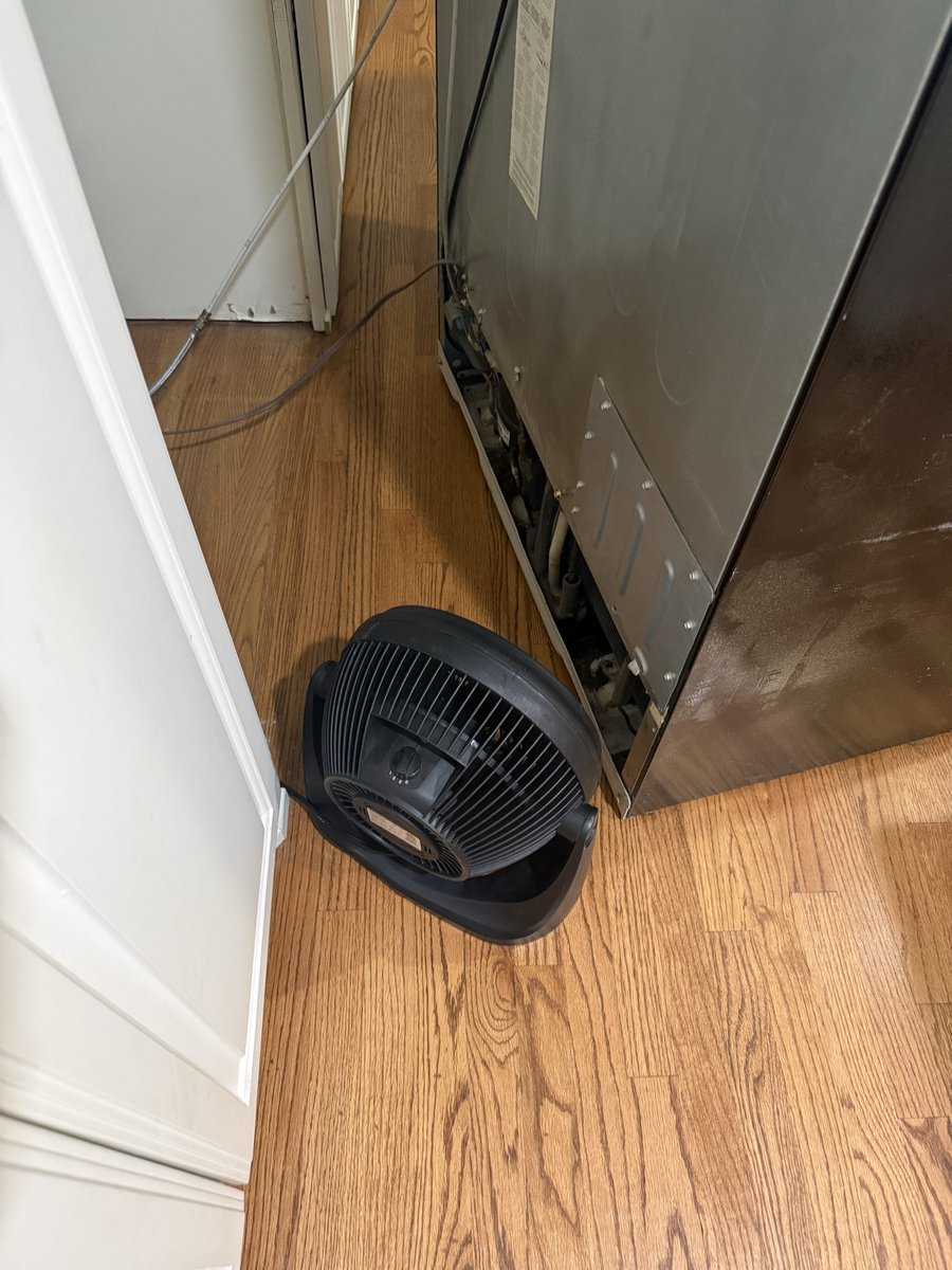 MrKyleStrouse's tweet photo. I’ve started doing some HVAC work on the side. Not really for the money, more for the XP. Condenser fan motor on my fridge broke, $30 part. If it weren’t for the knowledge I picked up working on HVAC/refrigeration there’s not way I would’ve been able to diagnose and fix this. Would have either spend $250+ on a service call or $1,000+ on a new fridge. Here I’ve got a fan set up to blow on the condenser coils while I wait for the new part to arrive.
