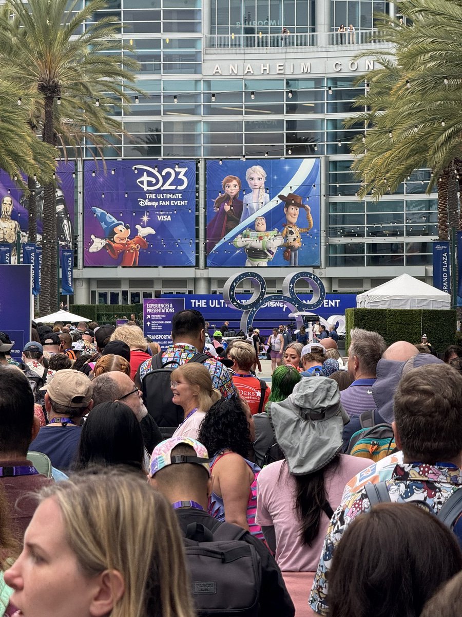 MousePlanet's tweet photo. Still waiting outside the convention center. People are frustrated by the lack of communication as to how the queue is being allowed into the venue, and tempers are flaring. @DisneyD23 #D23 https://t.co/MID0OaHTfy