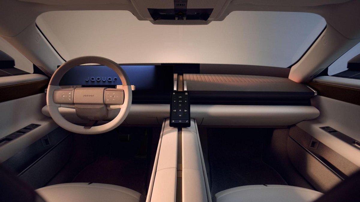 CARmagazine's tweet photo. Remember that controversial new electric Jaguar? Here's your first look at its rather cool interior https://t.co/z1CcQKXLqF https://t.co/Q0uFvIea3w