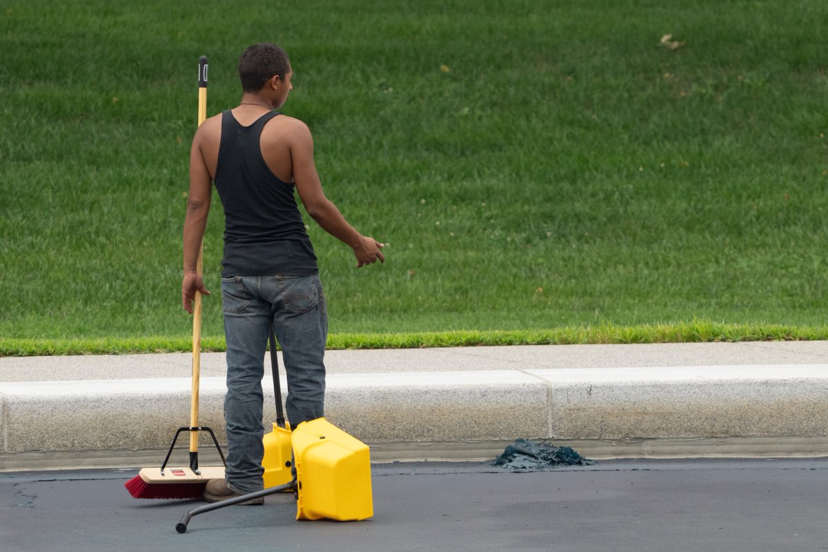 PenguinSix's tweet photo. Contractors armed with brooms and dustpans are sweeping out the ripped-up blue bits from the Reflecting Pool today. They've already filled a couple of trash bags worth. https://t.co/Or9TmZwa0q