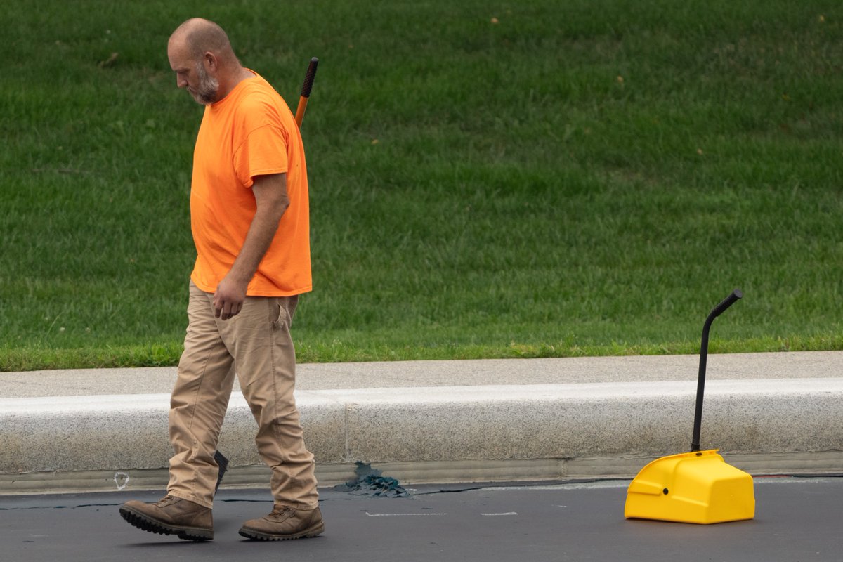 PenguinSix's tweet photo. Contractors armed with brooms and dustpans are sweeping out the ripped-up blue bits from the Reflecting Pool today. They've already filled a couple of trash bags worth. https://t.co/Or9TmZwa0q