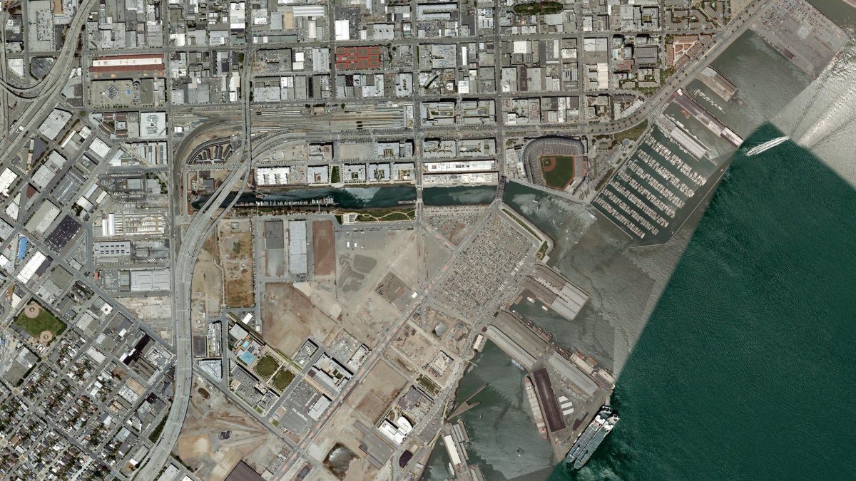KNBR's tweet photo. Oracle Park and surrounding areas in July 2007 compared to 2026. Mission Bay, South Beach, and Mission Rock have changed dramatically since the last time the All-Star Game came to San Francisco. https://t.co/2lyqXJkF2u