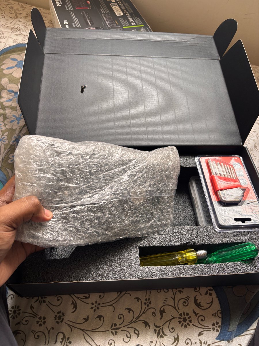 RahulRoy740411's tweet photo. Amazon India took ₹86,799 from me and delivered a box with a different graphics card inside, padded out with loose screwdrivers as weight filler.

I ordered an ASUS RTX 5070. The box serial is confirmed by ASUS's own database as the card I ordered. The card inside is not that card.

How it happened: Amazon clubbed two separate orders into one carton — the GPU, an Open Box Delivery item, and a UPS, which wasn't. One OTP came. I shared it thinking it was for the UPS. Only then was I told both were in the same box. The GPU was never opened or shown to me.

So an Open Box Delivery item was handed over on another order's OTP, and the inspection I paid ₹149 extra for never happened. Amazon's own order page STILL shows it as "Not yet serviced". 

I have CCTV footage. Photos. ASUS verification. The card is still sealed, untouched, available for inspection.

And what have I got? Called customer service more times than I can count — "we're escalating to the concerned team", every single time. Sent email after email. No reply. Executive Customer Relations gave me a deadline for resolution and blew through it.

The item is marked "not returnable" so I can't even raise a return. My EMI has started. I am paying instalments on a product I never received.

5 years an Amazon Prime customer. This is genuinely how you treat a customer with proof on his side? I want a refund. Nothing else.
@amazonIN @AmazonHelp @AmitAgarwal @ajassy @jagograhakjago