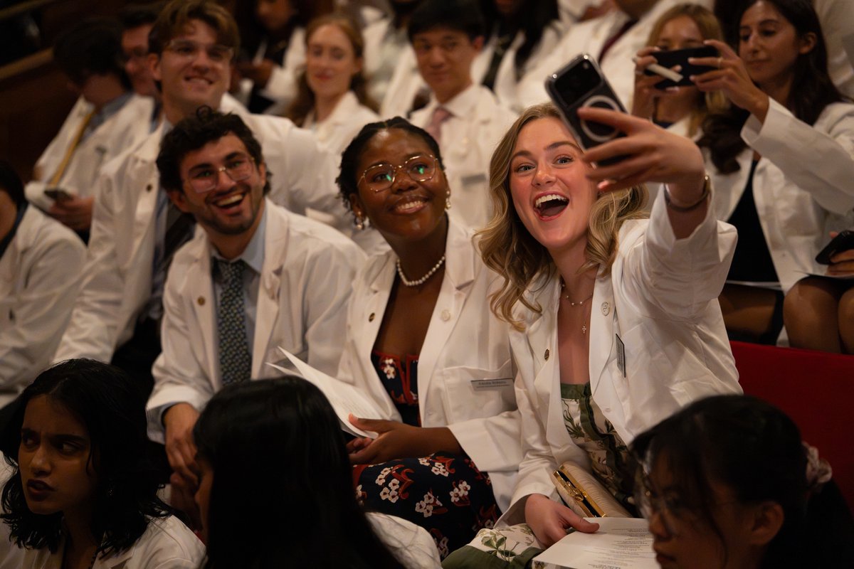 UofR's tweet photo. Today, the Class of 2030 arrived at @URochester_SMD—and put on their white coats for the very first time. ✨ 🩺

Congratulations to our newest class of future clinicians. We can't wait to see where your wonder takes you! 

#URochester2030 #WhiteCoatCeremony https://t.co/gsqxWuBVvb