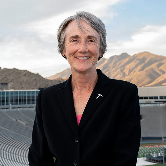 Portrait of UTEP President Heather Wilson in the Sun Bowl Stadium. The Franklin Mountains are in the background.