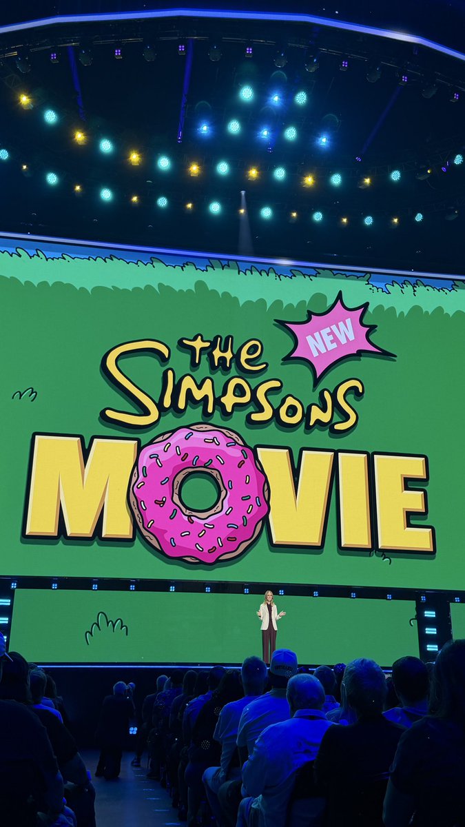 20thcentury's tweet photo. A NEW SIMPSONS MOVIE! Dana Walden gives fans at #D23 a sneak peek at what's coming to theaters in September 2027! https://t.co/Aem8jsQI2t