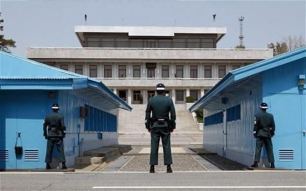 JoelAFreeman's tweet photo. NORTH KOREA & DMZ VISIT -- On July 12th, 1993 I was given a high level briefing at the DMZ (De-Militarized Zone). See the photo of the hat given to me, that was personalized for me. I was a bit overwhelmed and surprised by their forethought when they gave me the gift of the hat with my name on it. I sat in the same chair and received the same briefing President Bill Clinton had received the previous day, on July 11th, 1993.

General John Tilelli was the Commander of the Army Base. He gave me one of his "dog tag" coins as a gift. Those reading this who have been in the military know that it is a high honor to receive a challenge coin. I have quite a number of those coins given to me over the years.

A soldier assigned to giving these types of briefings gave me an historical overview of the stand-off and showed me the tunnels dug by N. Koreans...recently exposed. 

At the end of the briefing, I was told to make no sudden movements while we were on the DMZ. Some of the soldiers I saw were standing with only half of their bodies exposed. That is the norm at the DMZ. On the DMZ we saw the actual table in a small building in the middle of the DMZ used for face-to-face negotiations in the past.

We could see NK soldiers in the building opposite, looking at us through their binolulars. There is a NK town built up right at the DMZ to show the world that NK is prosperous. Thermal photography has been taken of that pretend village and no body heat or any other type of heat was found. An illusion.

I met soldiers stationed at the DMZ who were on a 45 second response time -- 24/7. There is little to no vegetation as you approach the region near the DMZ. You see machine gun turrets everywhere. And the concrete "bridges" over the main roads are designed to be blown up the moment an emergency is alarmed. That way those roads are closed to traffic immediately.

The purpose for my visit to S. Korea in 1993 was to conduct training for military (Army) leaders coming in to Seoul from around the Pacific rim for the training. I also conducted a training event for leaders at the Navy Base in Puson.

Limited Availability to Speak: 
https://t.co/3VgdaVOJio

#DMZ #southkorea #SKorea