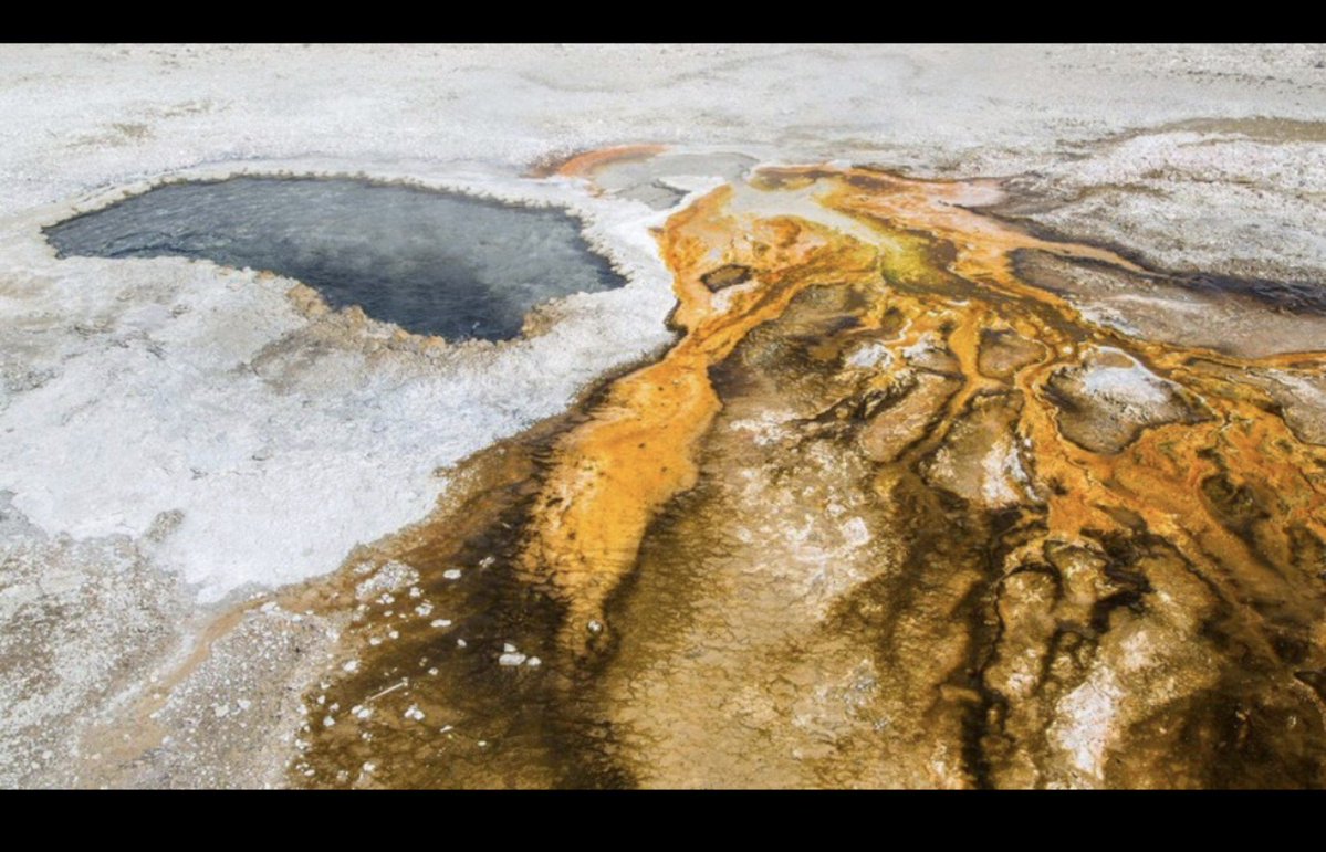 Scary_peeps's tweet photo. In 2018, a Yellowstone hot spring erupted after decades of relative quiet.

Then it started throwing up human trash from the past.

Ear Spring blasted out coins, cans, pieces of metal, a cinder block...

and even a baby pacifier dating back to the 1930s 

Some of the debris had apparently been sitting inside the geothermal system for generations before the eruption brought it back to the surface.

Park staff documented the objects, and some were considered historically significant enough for Yellowstone's collections.

The spring had effectively become a boiling underground time capsule.

And after decades...

it gave everything back.