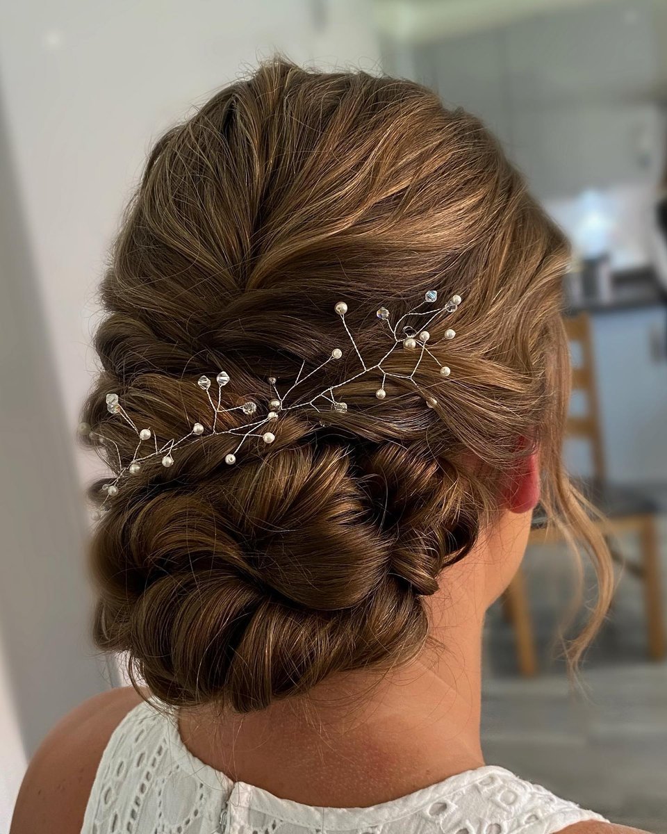 BoydLotshaw's tweet photo. As always, we’re in love with this classic bridal updo by @natalienicholsbridal, styled with her favorite @kykhaircare Magic Dust and MIST-IQUE spray. Explore the products online. https://t.co/t2DBWuGbYk