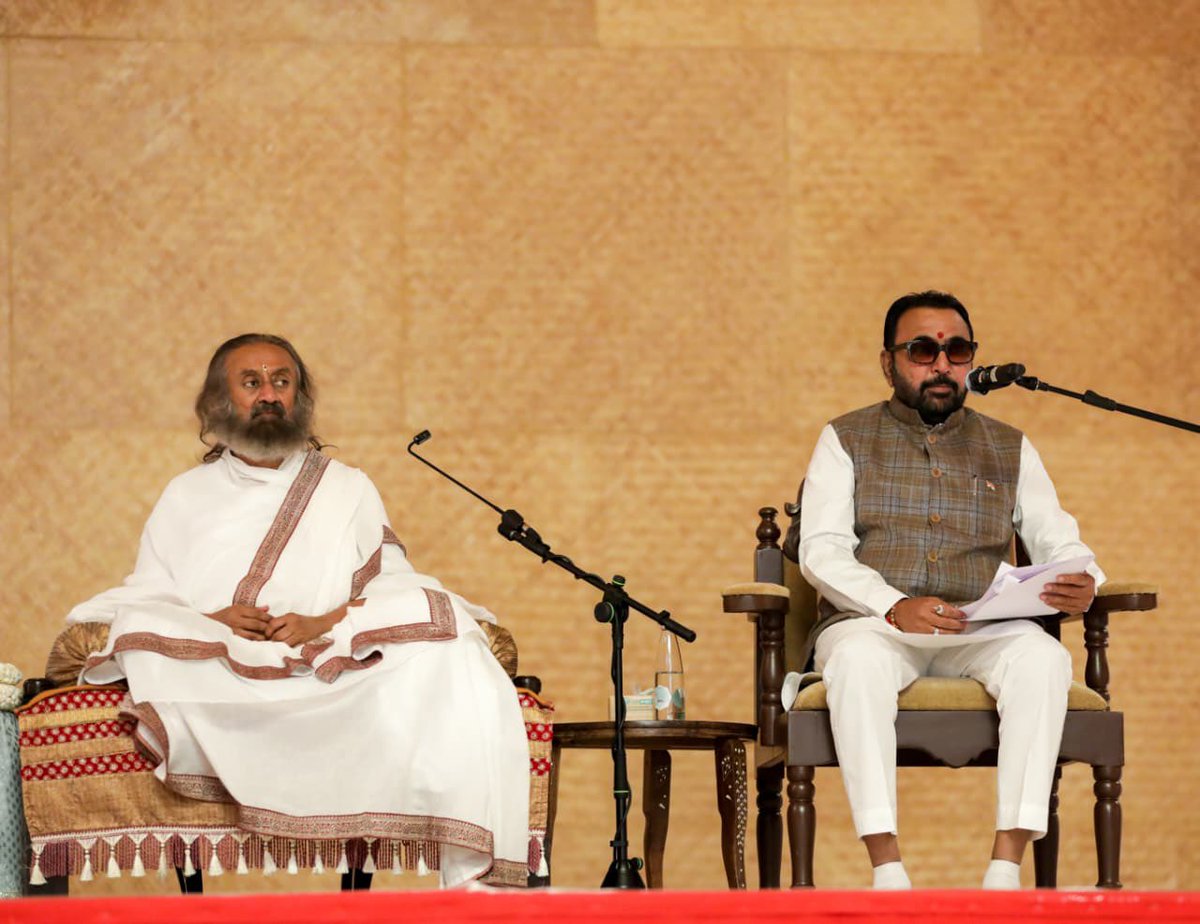 OfficeOfGurudev's tweet photo. Shri Prataprao Jadhav ji, Union Minister of State (Independent Charge) for the Ministry of Ayush and Union Minister of State for the Ministry of Health & Family Welfare, met @Gurudev and received His blessings — and also addressed the evening Satsang in presence of thousands of devotees gathered at @ArtofLivingIC.
 
@mpprataprao