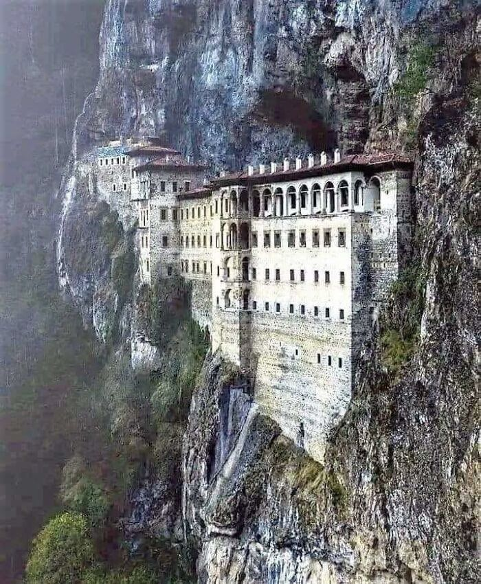 LeoDaVinciWave's tweet photo. Sümela Monastery doesn’t just sit in the mountains—it seems to emerge from the cliff itself. Perched roughly 1,200 metres above sea level in Turkey’s Pontic Mountains, this Greek Orthodox complex was built into an almost sheer rock face. What fascinates me is how the builders turned such an impossible landscape into a place of worship. Imagine choosing this cliff as the site for a monastery - what made them pick this exact spot?