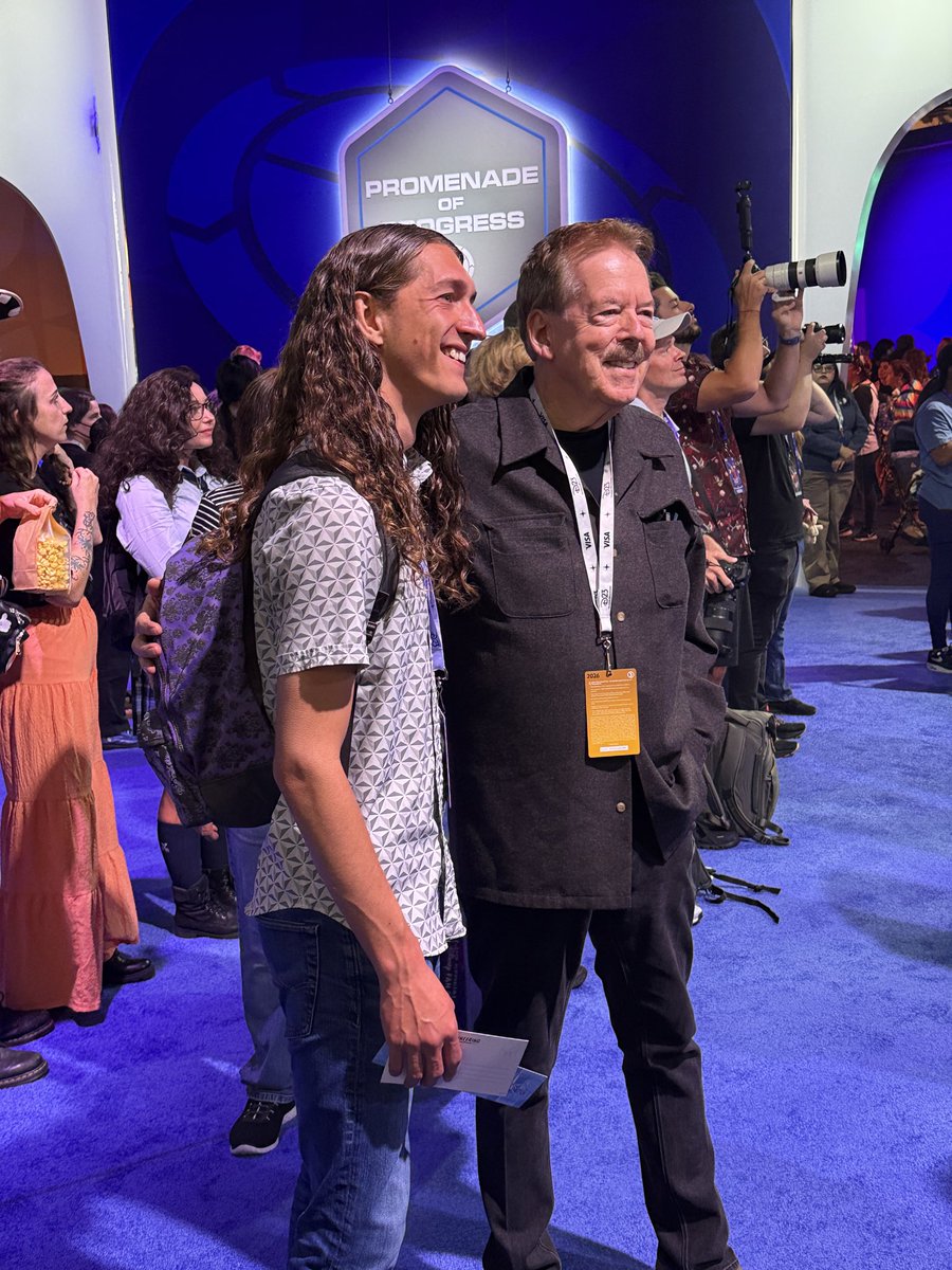 ScottGustin's tweet photo. I just watched Tony Baxter literally stop @OffhandDisney in the WDI pavilion to tell him how much he loves his content. One of the coolest moments I’ve witnessed all weekend. So damn cool. https://t.co/rL9ghjAEhG