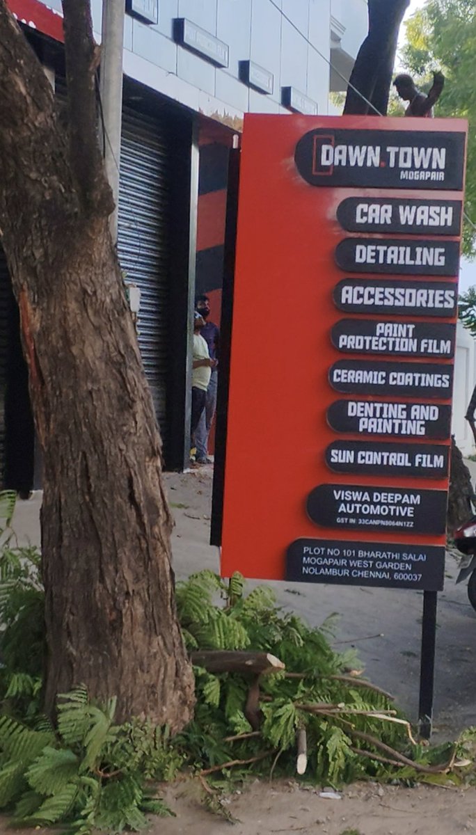 Kattaamai's tweet photo. A healthy street tree was just hacked down at I st main road,Nolambur, seemingly just to clear the view for a car wash signboard. Destroying green cover for business visibility is unacceptable. @chennaicorp please inspect and take strict action! 
Chennai  #SaveTrees https://t.co/5Bc9kb8IAL