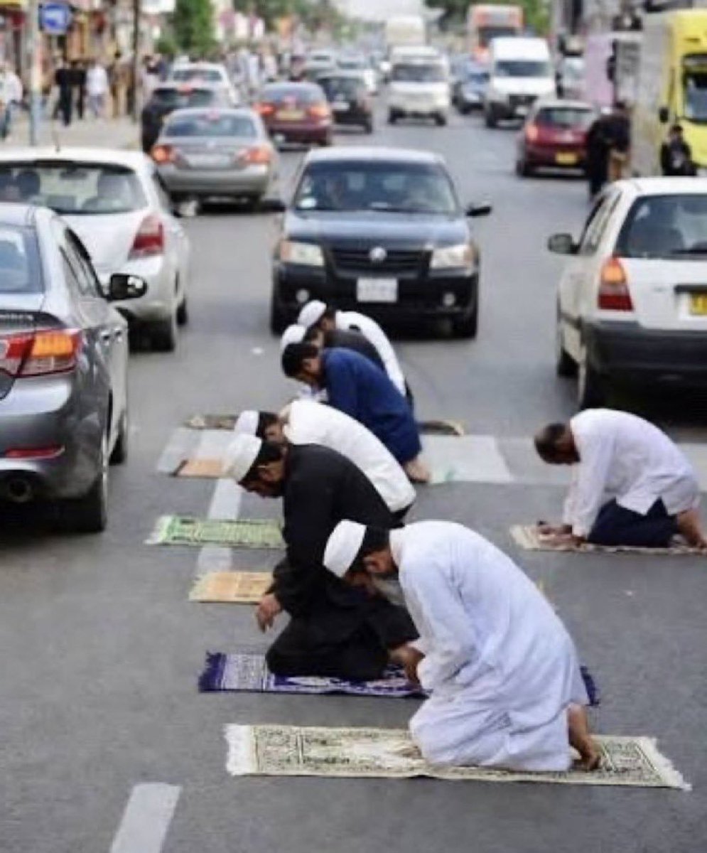 MelGibso1's tweet photo. Muslims left their houses, the mosque, and even the sidewalks, choosing instead to pray in the middle of the street...What's this called?? https://t.co/1InNsFlj0O