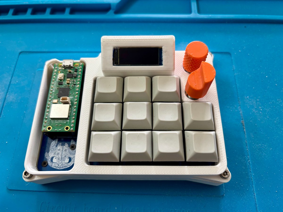 The_Ryaan_Ahmed's tweet photo. It's finally assembled. 🎉

Spent the last few hours finishing this macropad build.

Had to resolder a couple connections, added haptic actuators, heat-set the inserts, and sanded the case down until it actually looked clean.

Firmware and setup are next👀
Timelapse below 🎥👇 https://t.co/17oeimeKG2