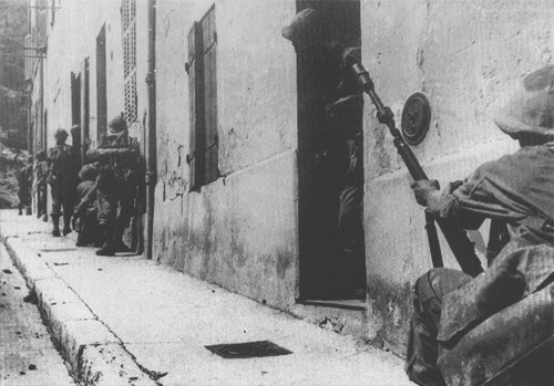 VoicesofWW2's tweet photo. French Algerian troops taking positions near the Notre-Dame de la Garde basilica, Marseille, France, 28 August 1944 https://t.co/rj9GOqmPvA