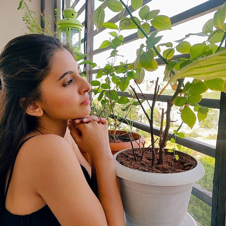 real_ghost007's tweet photo. Thread 1: 

Just standing among the plants, looking this effortlessly dangerous in black… unfair, honestly. 🌿🖤 #Preethi https://t.co/oVgRC60uba