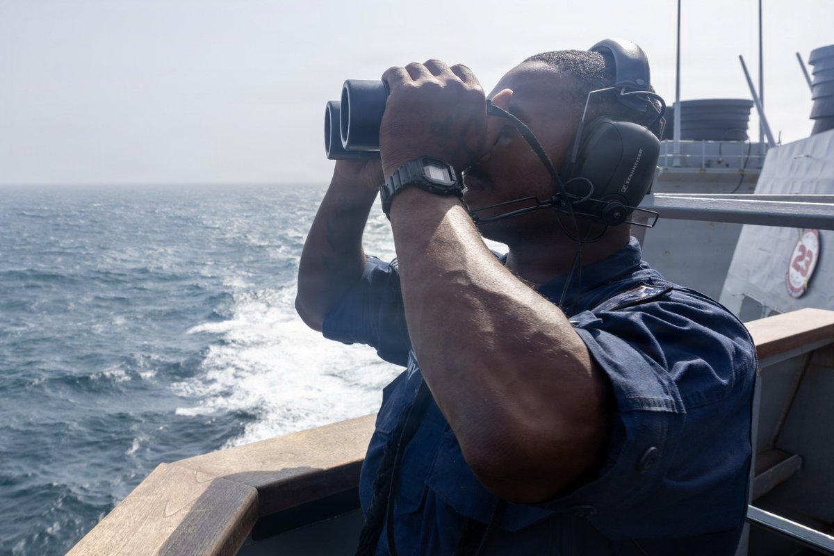 CENTCOM's tweet photo. A U.S. Sailor stands lookout watch aboard USS John Paul Jones (DDG 53) as the ship sails in regional waters enforcing the U.S. blockade against Iran. As of Aug. 28, CENTCOM forces have redirected 82 commercial vessels, disabled 3 and boarded 2 to ensure compliance.
