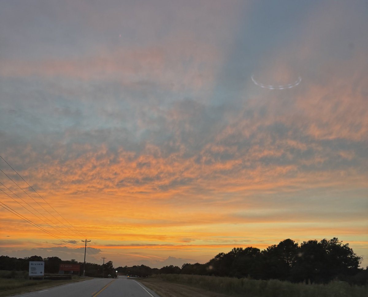DarBer's tweet photo. I thought I was simply taking a photo of the beautiful colors of the sunset and clouds. But it seems that I captured an image of a #UFO overlooking the @Rivian site near Social Circle, GA. https://t.co/7vaZRgJgwf