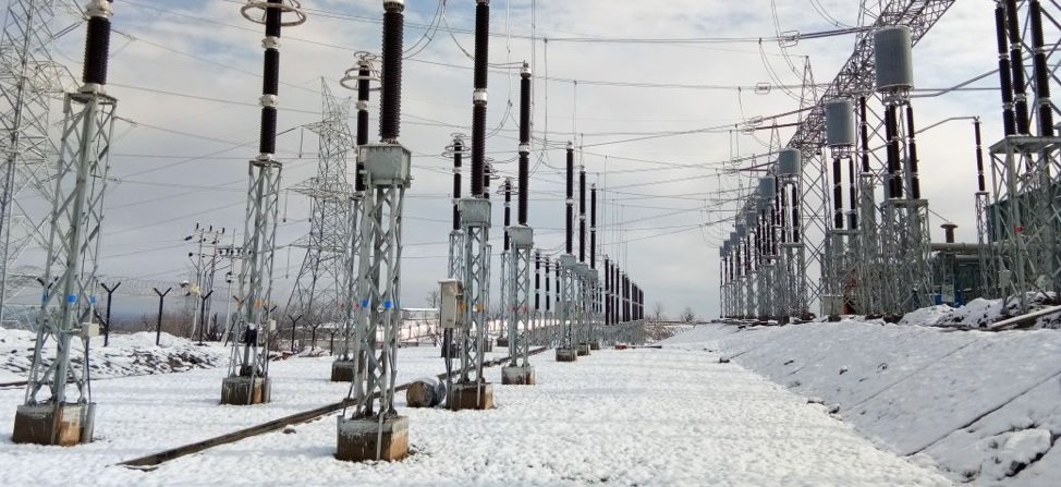Fintech03's tweet photo. On Feb 3, 2019, PM Modi formally dedicated a massive piece of high altitude infrastructure to the nation: the Srinagar-Alusteng-Drass-Kargil-Khaltsi-Leh 220 kV Transmission Line.

Built by POWERGRID across ~335 km at a cost of ~₹2,266 crore, the project integrated the connected areas of Leh and Kargil into India’s National Electricity Grid for the very first time.

Before 2019, the region relied on an isolated local setup.

- During harsh Himalayan winters, river discharge fell sharply. 

- Run of river stations like NHPC’s Nimoo-Bazgo (45 MW) and Chutak (44 MW) which operate without large storage reservoirs saw generation plunge, while smaller regional streams froze over.

- To keep lights on and critical services running when mountain passes closed, millions of liters of diesel fuel had to be stockpiled before winter set in.

The real engineering challenge to build this...

- The transmission line crosses Zoji La (~11,580 ft / 3,530 m) and Fotu La (~13,480 ft / 4,110 m), with peak tower elevations reaching up to 13,500 feet.

- POWERGRID collaborated with DRDO’s Snow & Avalanche Study Establishment (SASE) to site towers away from active slide paths and design heavy-duty chimney foundations capable of handling snow-pack creep in avalanche-prone corridors like Gagangir and Zoji La.

- Reduced air density at high altitudes lowers the dielectric strength of air, increasing the risk of electrical arcing. Engineers mitigated this by expanding line clearances and redesigning insulator strings on overhead sections, while deploying compact Gas-Insulated Substations (GIS) at Drass, Kargil, Khaltsi, and Leh.

- Construction was restricted to short 4-5 month summer windows, relying on airlift and manual haulage on roadless stretches.

The 2019 commissioning was not the end of the story, but the crucial foundation: It provided major urban centers in Leh and Kargil with stable, year-round grid power, drastically cutting urban winter reliance on diesel.

Outlying regions like Zanskar, Nubra, and parts of the Changthang plateau were not connected overnight; they required subsequent extension projects branching off this primary line.

It remains one of the most complex high-altitude electrical transmission projects ever completed in India, silently keeping the power flowing over some of the most formidable mountain passes in the world.

Bharat is rising. 🙏🙏
