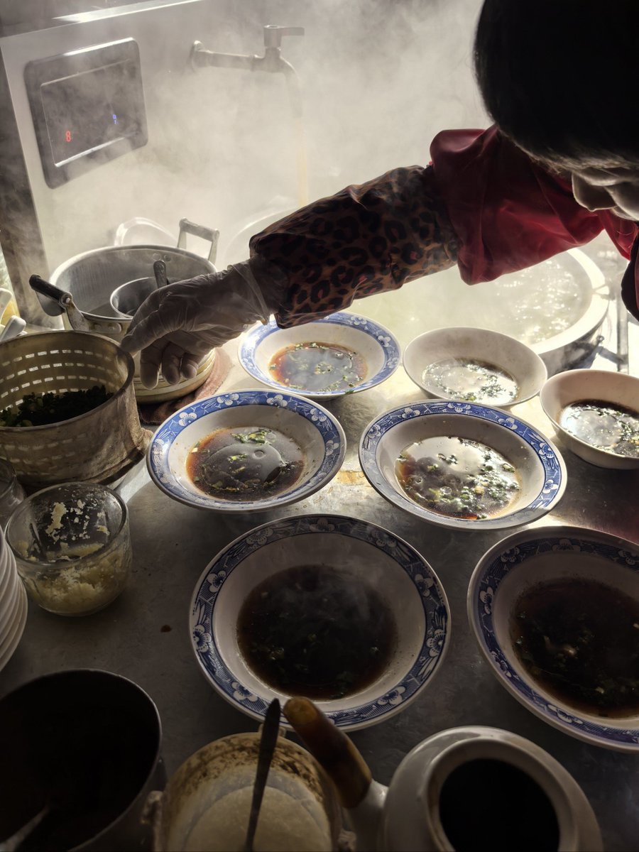 noemiesparza's tweet photo. It’s 11 PM here, and the small restaurant’s still warm. Hot tonkatsu soup with crispy cabbage, and the old boss hums softly while wiping bowls. No rush, just quiet little warmth for late souls. https://t.co/w2TiWzUick