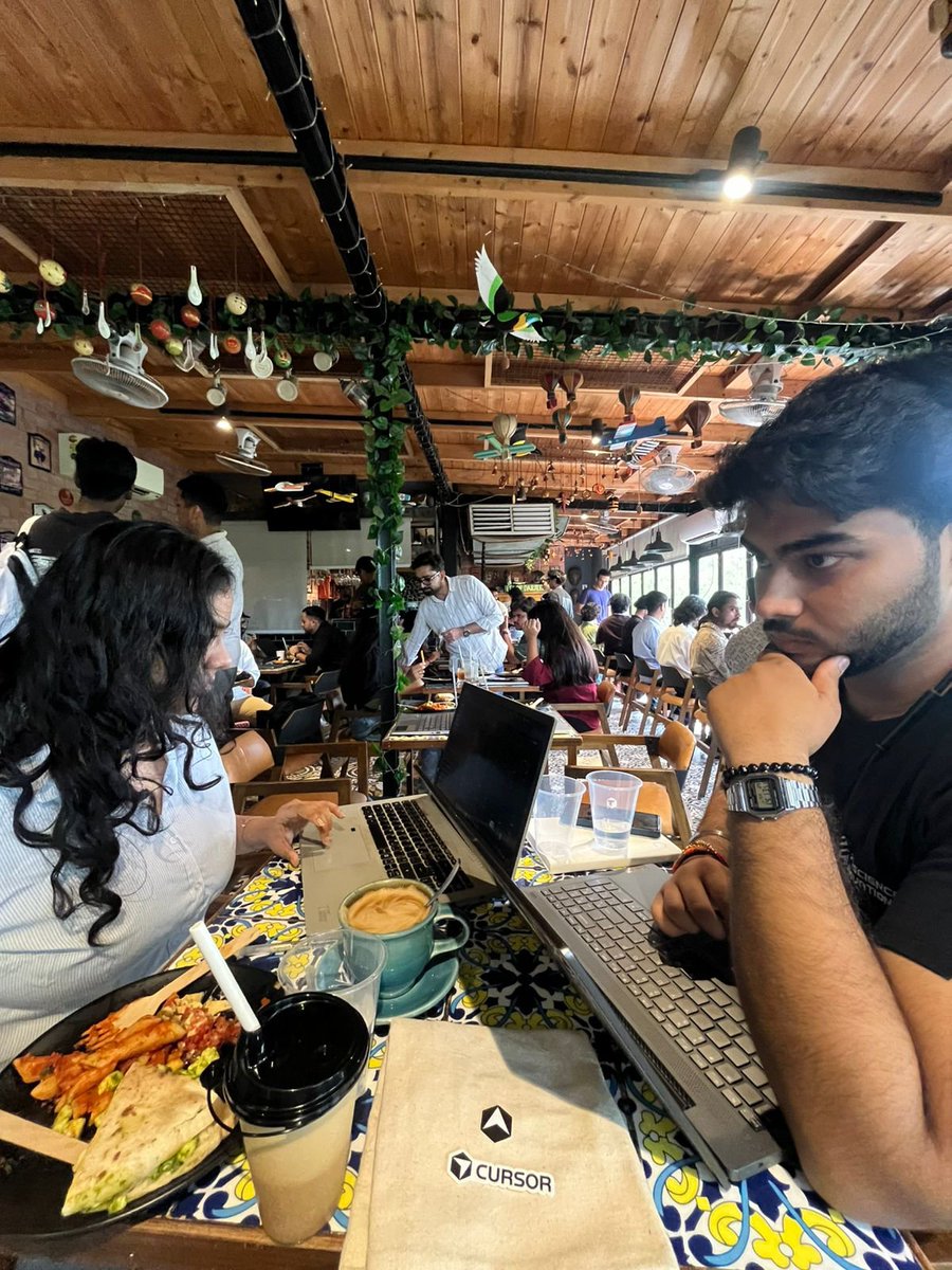 chiragx19's tweet photo. building quovo @ cursor cafe, delhi 

&amp; she's devouring that plate

#cursorcafe 
#cursor https://t.co/u0U7s5wons
