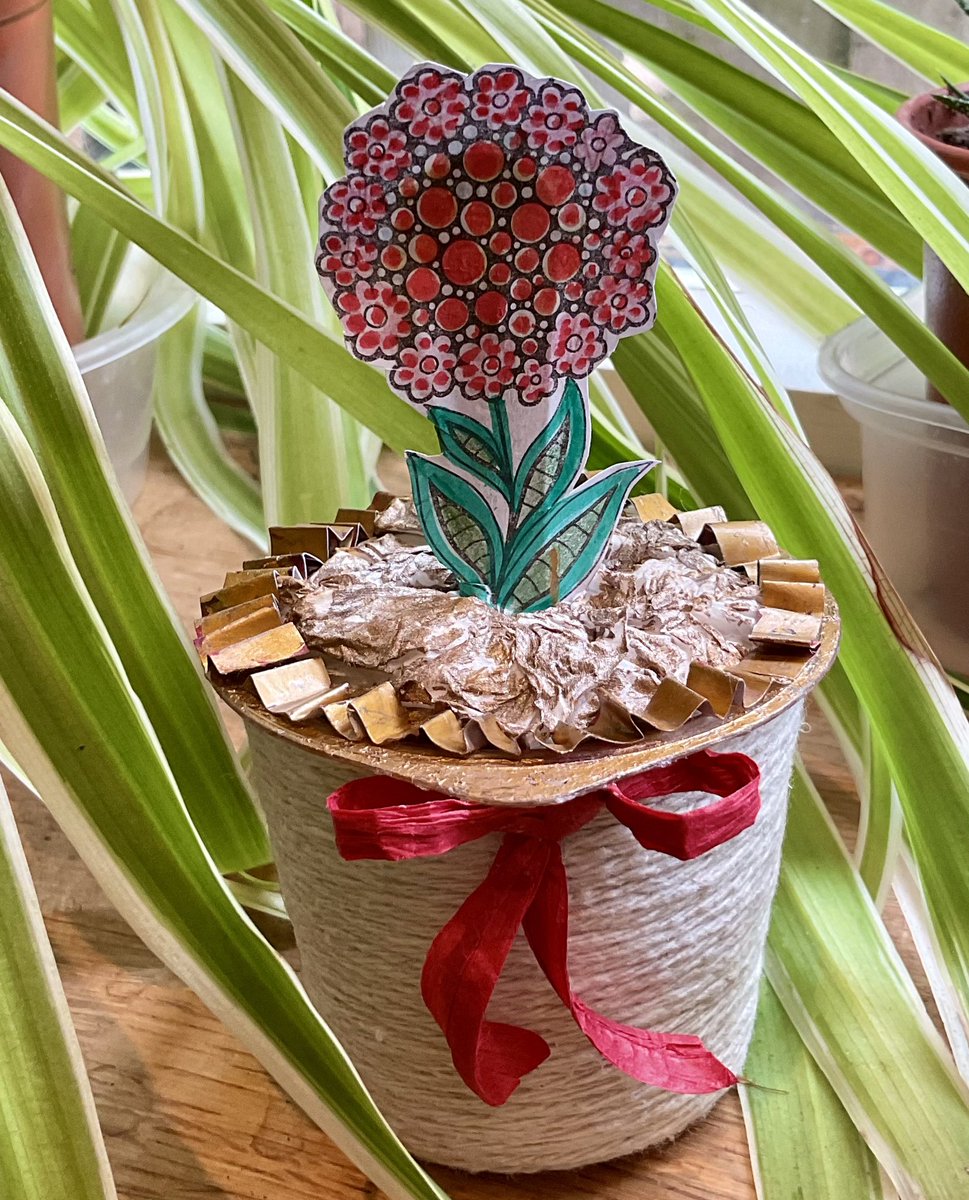 be75121834's tweet photo. With a small plastic pot, some old string, some kind of glue or paste and random bits from your recycling bin you too could make a plant in a pot - and the best thing is that it doesn’t need watering!  😎 https://t.co/DxvY0xYN59