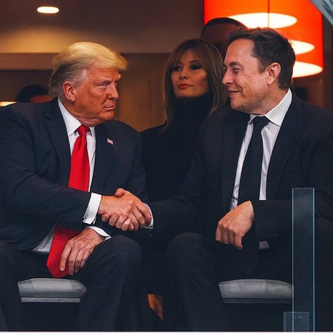 Xammien's tweet photo. Elon Musk &amp; Trump shaking hands 🇺🇸 https://t.co/NatXIh376D