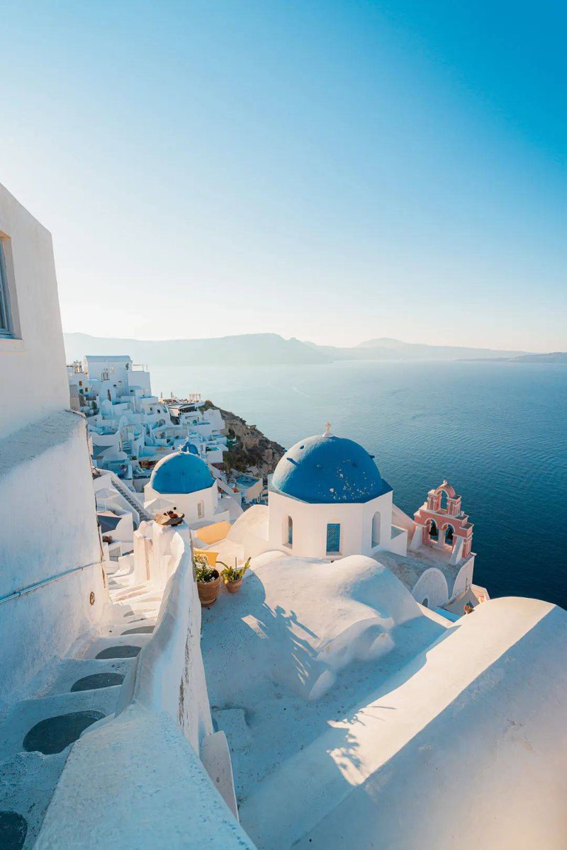 DahiiaBuiitrago's tweet photo. Chased golden hour over Santorini’s white domes today—sunset painting the Aegean pink, wind carrying the scent of jasmine and grilled seafood. This is the kind of moment that sticks to your soul ， https://t.co/b7O02ihLuD