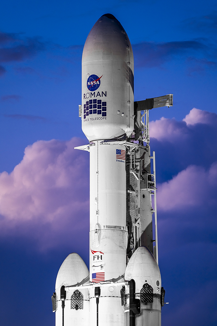 LaunchPhoto's tweet photo. Falcon Heavy, poised for launch carrying NASA's Nancy Grace Roman Space Telescope just after sunrise Sunday. https://t.co/R6CuwAYk4z