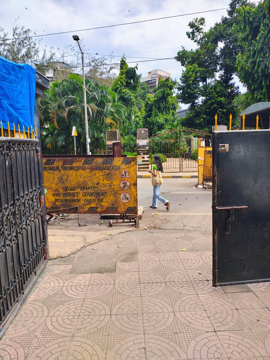 JayKhuthia's tweet photo. @mybmcwardKW @mybmc these barricades were placed to cover drain holes 2 months back. The rains have gone, but bmc hasn't got time to clean the drains and remove these barricades. It's resulted in shortening of road and only 1 vehicle passing due to barricades on both sides. https://t.co/djUaxym1DK