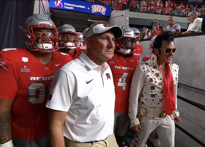 Brett_McMurphy's tweet photo. Elvis leads UNLV onto field - fittingly - before Rebels played Memphis 🤣 https://t.co/QFMjq0Oerv